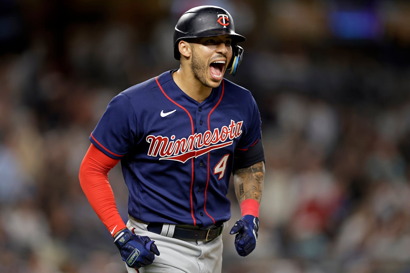 Carlos Correa reacts after hitting a two-run home run against the New York Yankees during the eighth inning Thursday