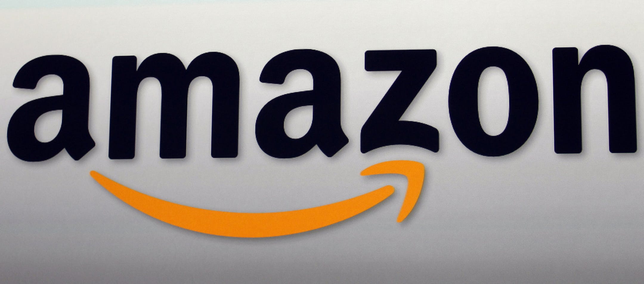 FILE - This Sept. 6, 2012, file photo shows the Amazon logo in Santa Monica, Calif. On Wednesday, Oct. 11, 2017, Amazon announced that teens can now shop at Amazon on their own, if their parents let them. Adults can add up to four teenagers to their account, giving youngsters their own login information to buy stuff from the Amazon app. Parents can set spending limits, cancel orders and get notifications when something is bought. (AP Photo/Reed Saxon, File)