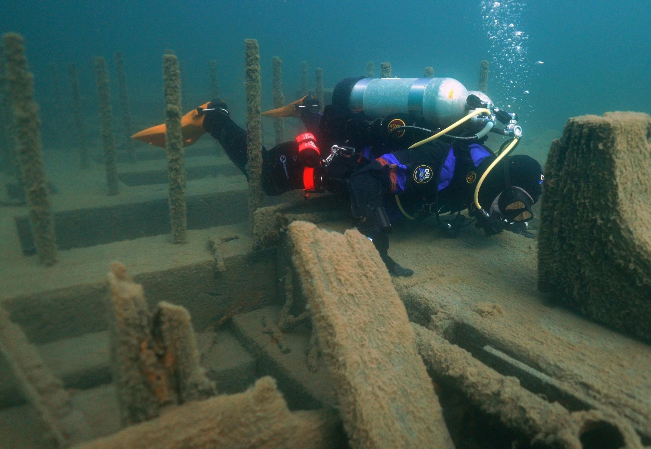 Jack Decker, a diver with the Great Lakes Shipwreck Preservation Society from Clear Lake, Iowa, examined the keel on the Hesper.