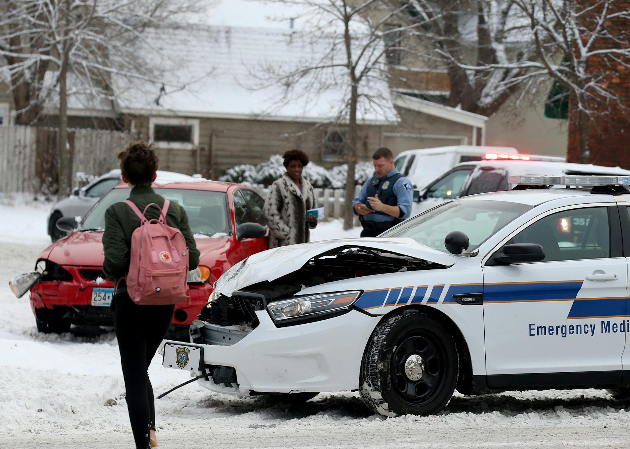 An Emergency Medical Services vehicle was among vehicles involved in crashes, this one at Cedar and 32nd St. South after an overnight snowfall Thursday, Nov. 29, 2018, in Minneapolis, MN.] DAVID JOLES ï david.joles@startribune.com Overnight snow fall