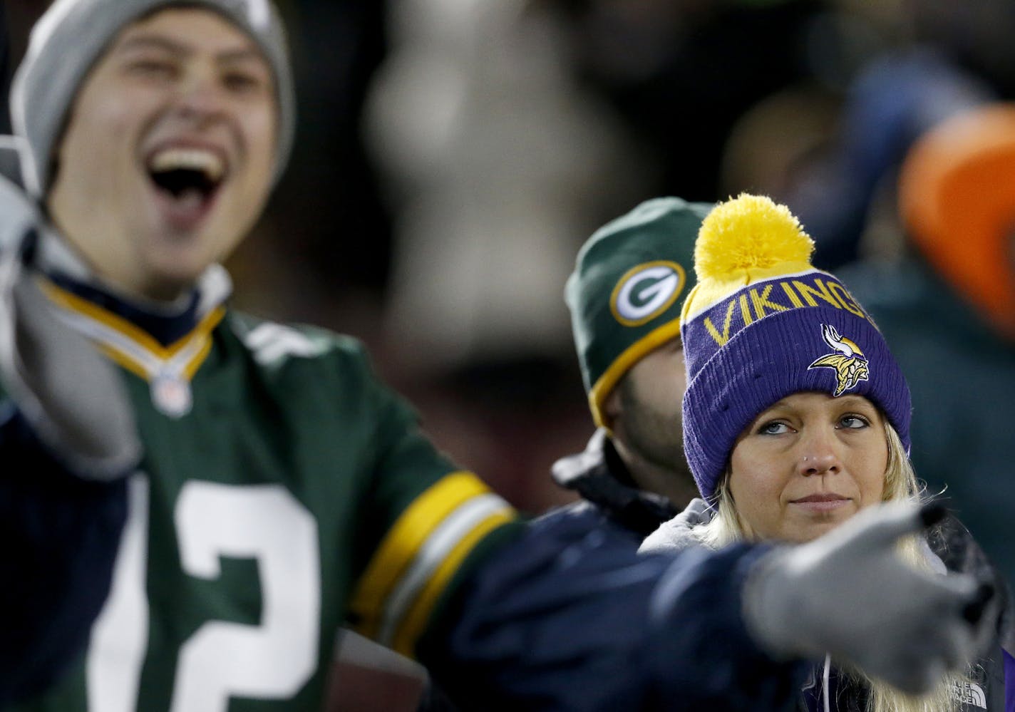 Green Bay Packers fan Mason Horacek, 24, of Yankton South Dakota cheered at the end of the game as Minnesota Vikings fan Shelly Bye, 26, had a different expression. Green Bay beat Minnesota by a finals score of 30-13. ] CARLOS GONZALEZ &#xef; cgonzalez@startribune.com - November 22, 2015, Minneapolis, MN, TCF Bank Stadium, NFL, Minnesota Vikings vs. Green Bay Packers