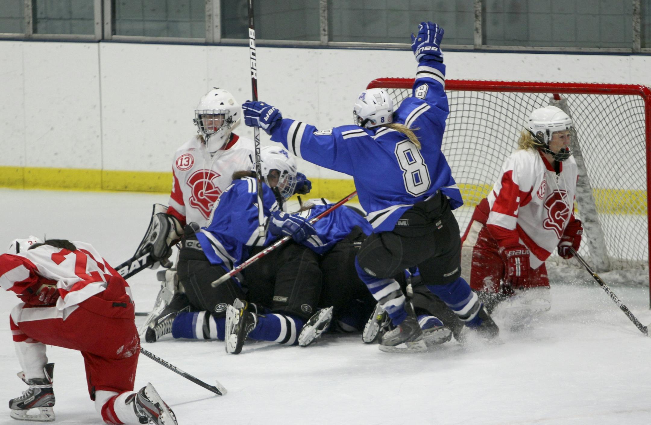 Minnetonka's Sydney Baldwin celebrated with her teammates after Diana Draayer shot the winning goal into the during overtime period action of the Class 2A Section 6 finals in Minneapolis Min., Friday, February 17, 2012. Minnetonka won 2-1.