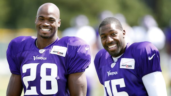 Minnesota Vikings Adrian Peterson (28) and Greg Jennings (15) during the afternoon practice. ] CARLOS GONZALEZ cgonzalez@startribune.com July 29, 2013