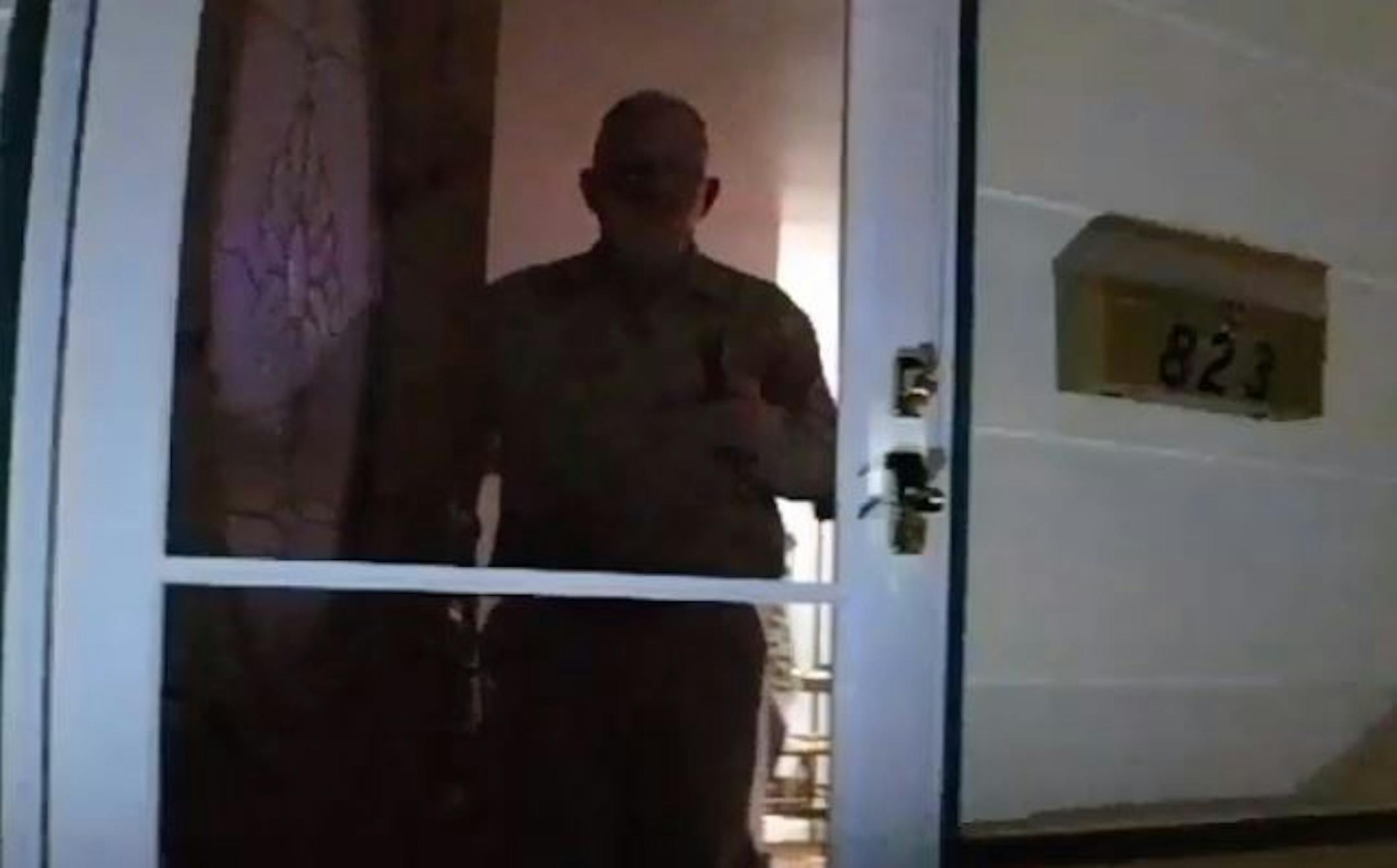 This image from Shakopee police officer Thor Carlson's body-worn camera shows James Hanchett raising a gun in his hand.