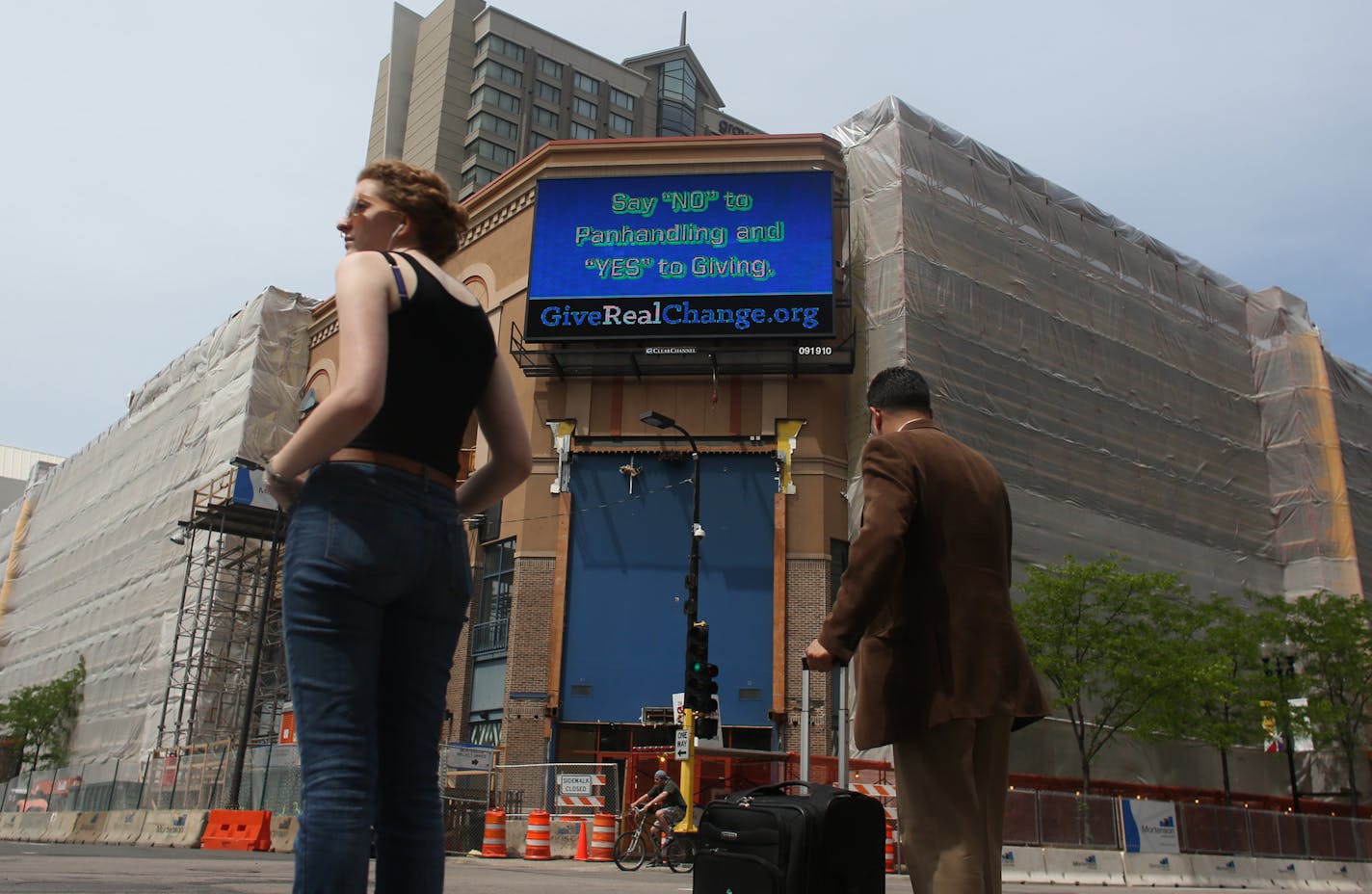 An electronic billboard on Block E promoted the Give Real Change campaign, which tries to redirect donations from panhandlers.