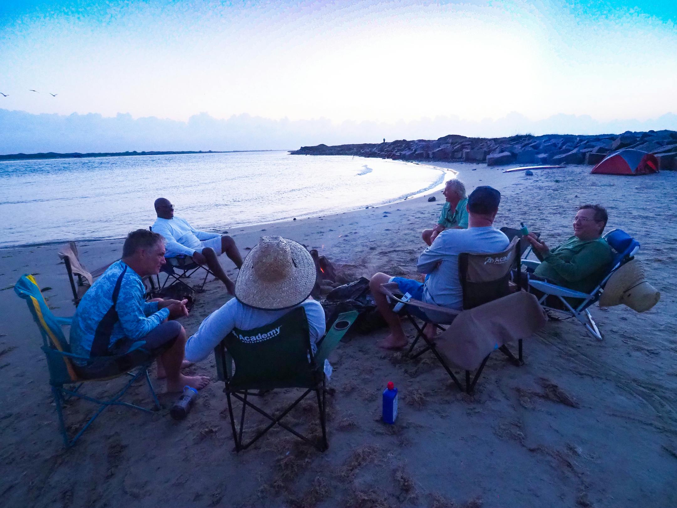 A group of men, most of whom grew up together in Brownsville in the 1970s and 80s, met for a beach camping trip at Mansfield Cut in May 2018. Here they enjoy sunset. (Pam LeBlanc/American-Statesman/TNS)