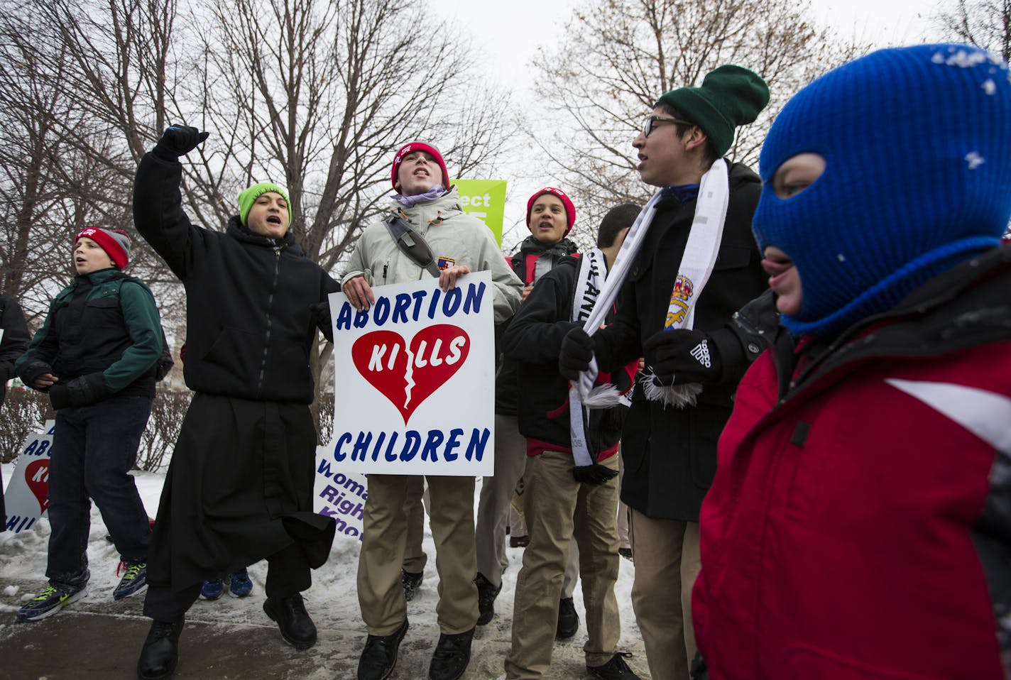 Students fromBlessed Jos&#xc8; Sanchez Del Rio High School Seminary in Mankato sing and chant as passerby march past during the annual Minnesota Citizens Concerned for Life March for Life at the State Capitol Mall in St. Paul on Friday, January 22, 2016. ] (Leila Navidi/Star Tribune) leila.navidi@startribune.com