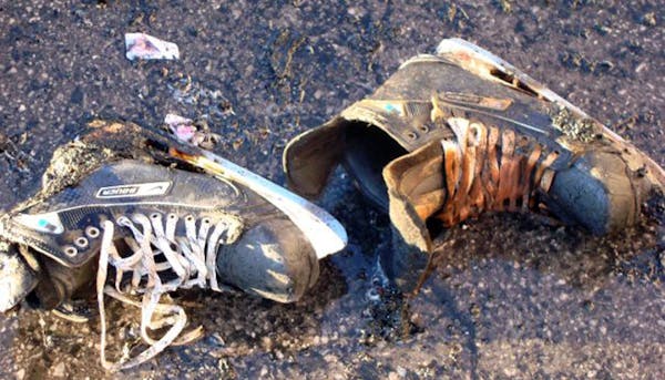 provided photo / credit: Barrie Roney Ottawa , Canada, 12/18/2009 ] burned skates a result of the Minnesota wilds equipment truck fire en route from t