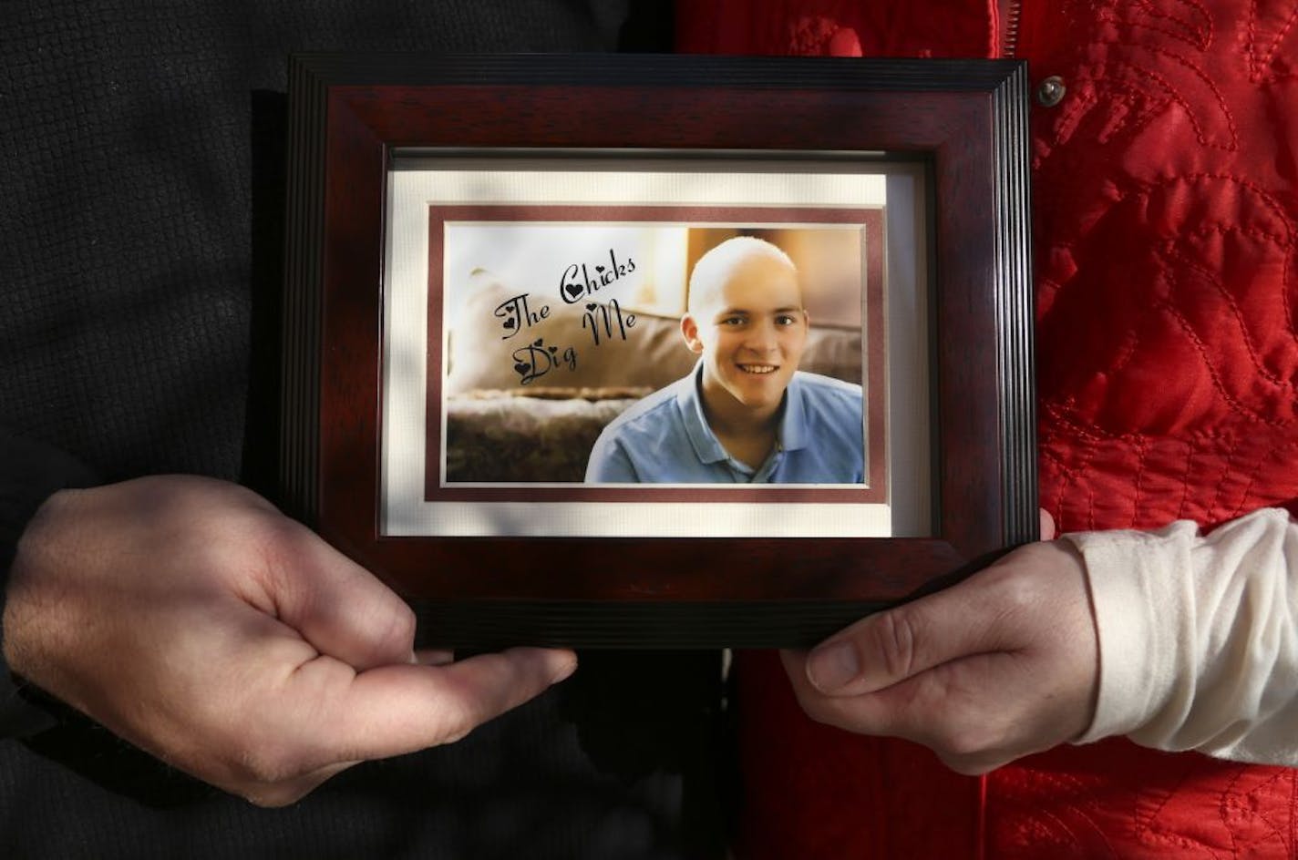 Ed and Debbie Witschen held a picture of their son Dylan, who died of brain cancer two years ago.