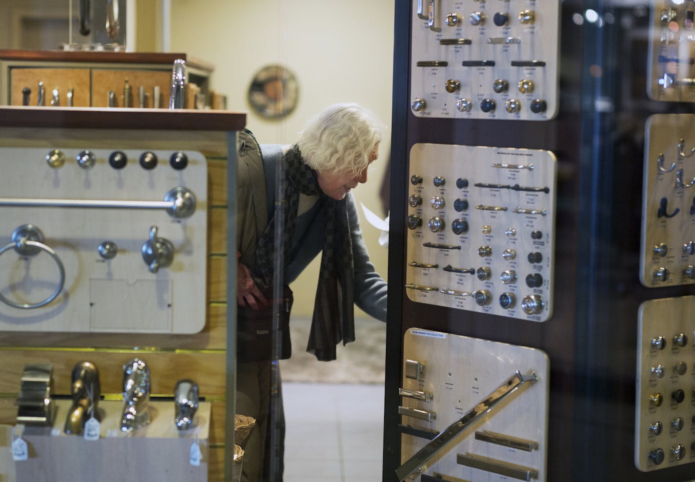 At "The Brass Handle" store at the Galeria which is moving out, Sara Monick shopped for fixtures for her 50-year old house in Golden Valley.] Richard Tsong-Taatarii/rtsong-taatarii@startribune.com