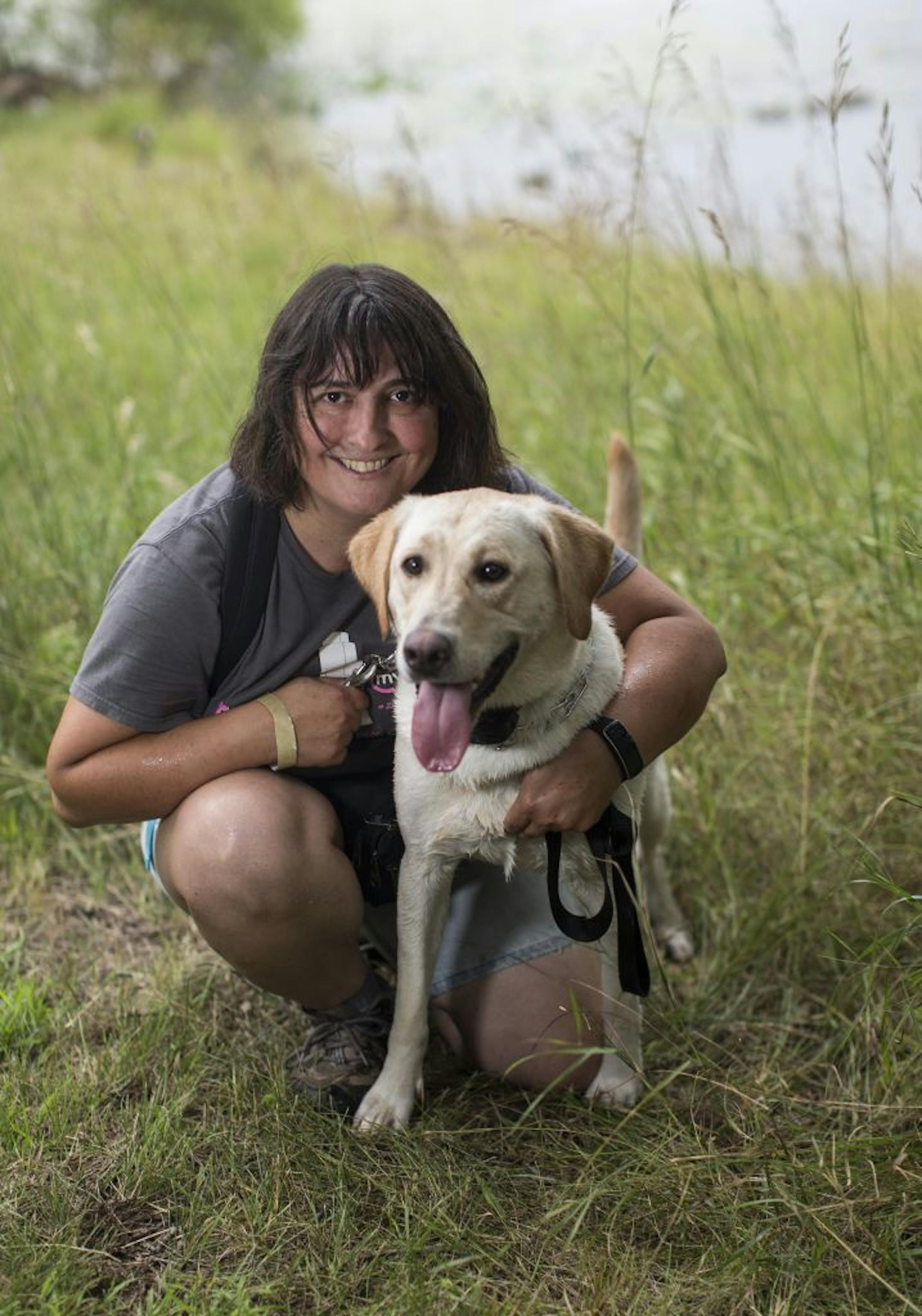 Missy Delorenzo, Buffalo, Minn., with Skylar the Labrador   The 2015 Gamefair has developed from one big circus tent to a mini State fair atmosphere over its 34 years. We photographed a slice of the fair through the people that have attending this year, some who have been all 34 years.  [ PHOTO BY TOM WALLACE ' tom.wallace2@comcast.net   owfair081415: Game Fair