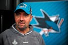 San Jose Sharks head coach Peter DeBoer talks with a reporter during Stanley Cup Finals media day in Pittsburgh, Sunday May 29, 2016. The Sharks face 
