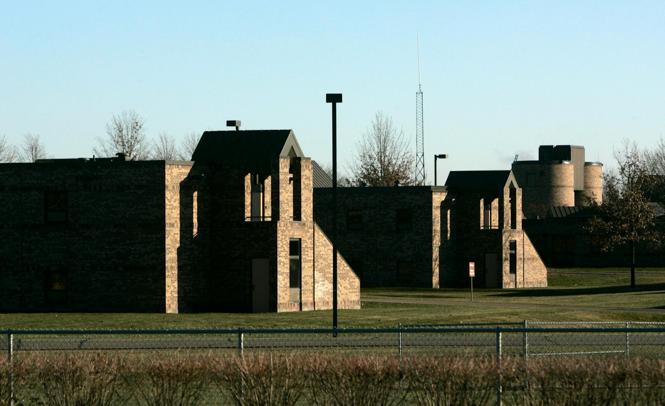 Currently at the Shakopee women's prison, a fence and hedges surround the property.