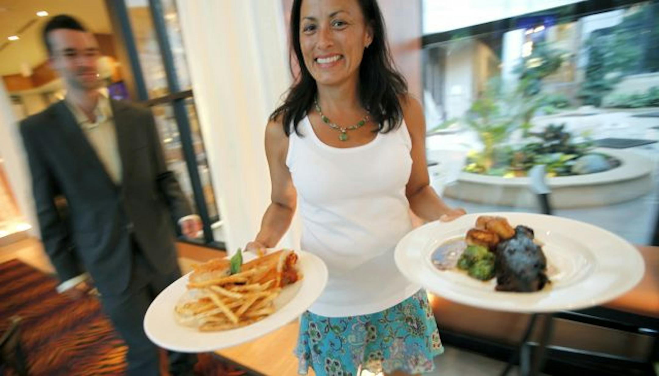 At Faces Mears Park, Lori Fhima, spouse of chef/co-owner David Fhima, acts as an all-smiles intermediary between kitchen and table.