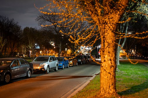 Cars park along The Mall at night in Minneapolis on April 30.