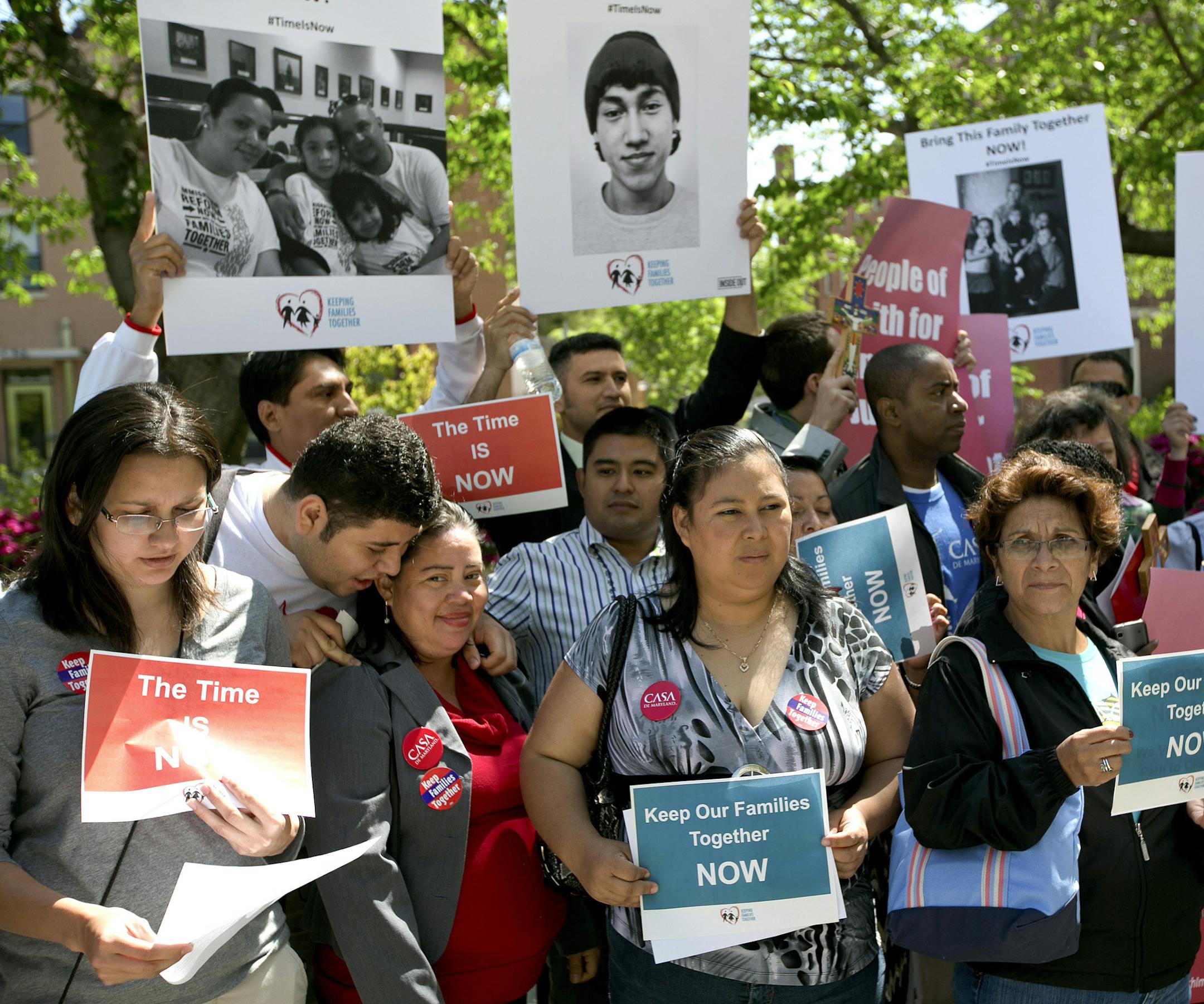People demonstrate outside the Hart Senate Office Building on Capitol Hill in Washington, April 25, 2013. Sens. John McCain (R-Ariz.) and Charles Schumer (D-N.Y.), who are leading a push for bipartisan immigration legislation, said Thursday that they were aiming to win 70 votes in the Senate and hoped to gain the backing of a majority of senators in both parties. (Doug Mills/The New York Times)