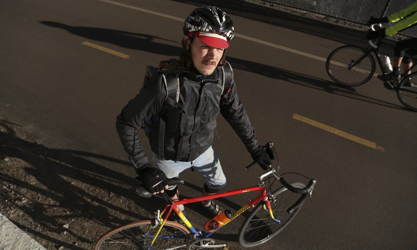 Drew Ditlefsen stood with his bike on the Midtown Greenway where he rides at least four times a day in Minneapolis.