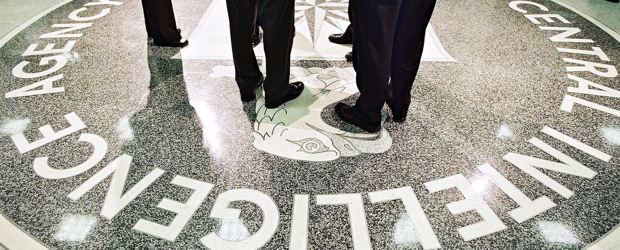 FILE -- President George W. Bush and CIA Director George Tenet stand on the agency’s seal at CIA headquarters in Langley, Va., March 20, 2001. In more than 500 pages, the Senate Intelligence Committee’s summary, released on Tuesday, paints a devastating picture of a CIA ill equipped to take on the task of questioning Al Qaida suspects, bungled the job and then misrepresented the results. (David Burnett/Pool via The New York Times) -- FOR EDITORIAL USE ONLY.