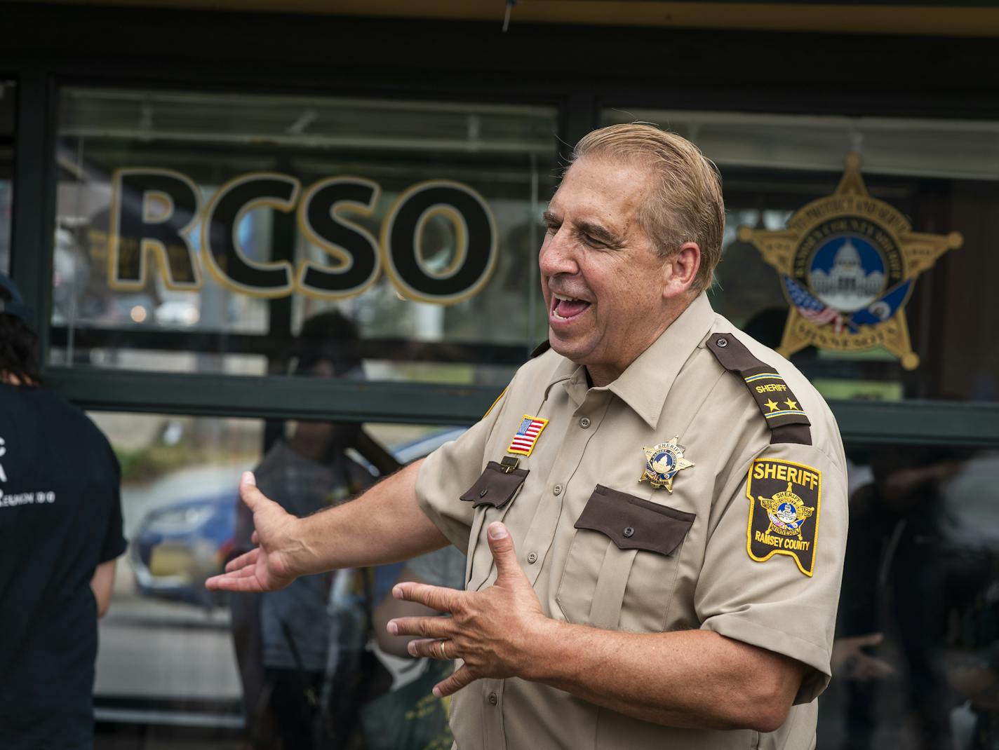 Ramsey County Sheriff Bob Fletcher invited people inside for food after the ribbon-cutting at the Rice Street substation. "Being out in the community is a critical component," he said.