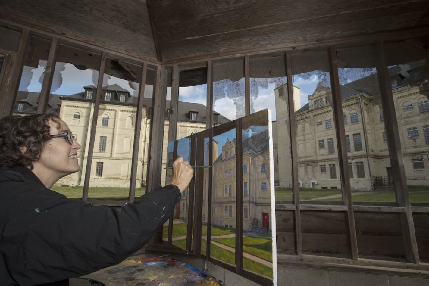 Mary Proenza painted a scene at the Kirkbride, once the states largest mental institution as part of Springboard for the Arts project. Springboard for the Arts is a St. Paul nonprofit trying to bring art to rural Minnesota Wednesday June 28, in Fergus Falls, MN.