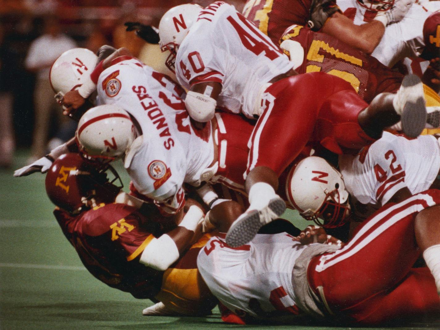 Gophers running back Darrell Thompson was buried under an avalanche of white-shirted Cornhuskers in 1989.