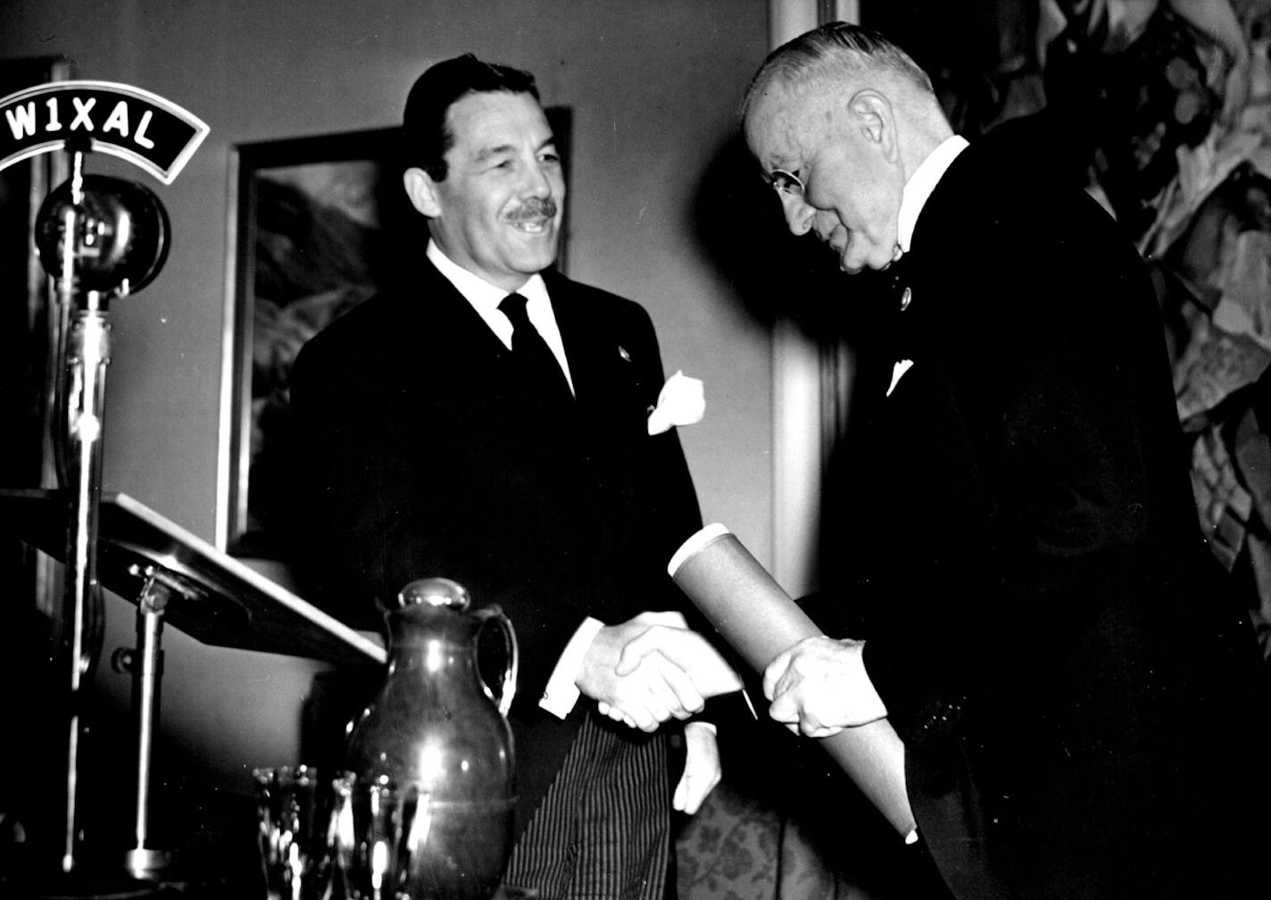 May 4, 1939 International Business Machines opens Exhibit at world's Fair New York, N.Y.-Grover A. Whalen, President of the New York World's Fair Corporation, is shown as he presented a scroll to Thomas J. Wayson, President of the International Business Machines Corporation here today during ceremonies attending the dedication of the I.B.M. exhibit at the fair. Mr. Watson earlier had presided over a gathering of 4,000 persons in the hall of music, marking contributions Mr. Watson has made to international amity. Speakers at the dedication ceremonies included Dr. Nicholas Murray Butler of Columbia University, MRS. Vincent Astro, Mr. Whalen and Mr. Watson. Wide World Photo