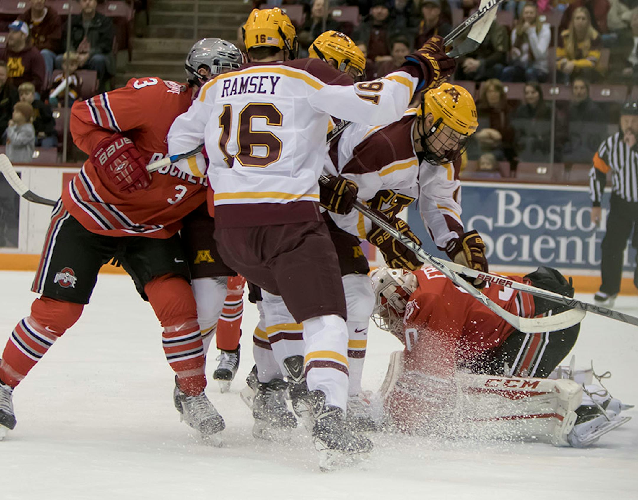 Minnesota Golden Gophers forward Jack Ramsey (16) and others crash the net Ohio State Buckeyes goalie Christian Frey (30) covers the puck and Ohio State Buckeyes defenseman Sasha Larocque (3) defends as the Minnesota Golden Gophers hosted the Ohio State Buckeyes to open the Big Ten Conference schedule on December 4, 2015. ] Special to Star Tribune MATT BLEWETT ï matt@mattebphoto.com - December 4, 2015, Minneapolis, MN, Big Ten Hockey, Minnesota Golden Gophers vs. Ohio State Buckeyes, 257622 UPUK