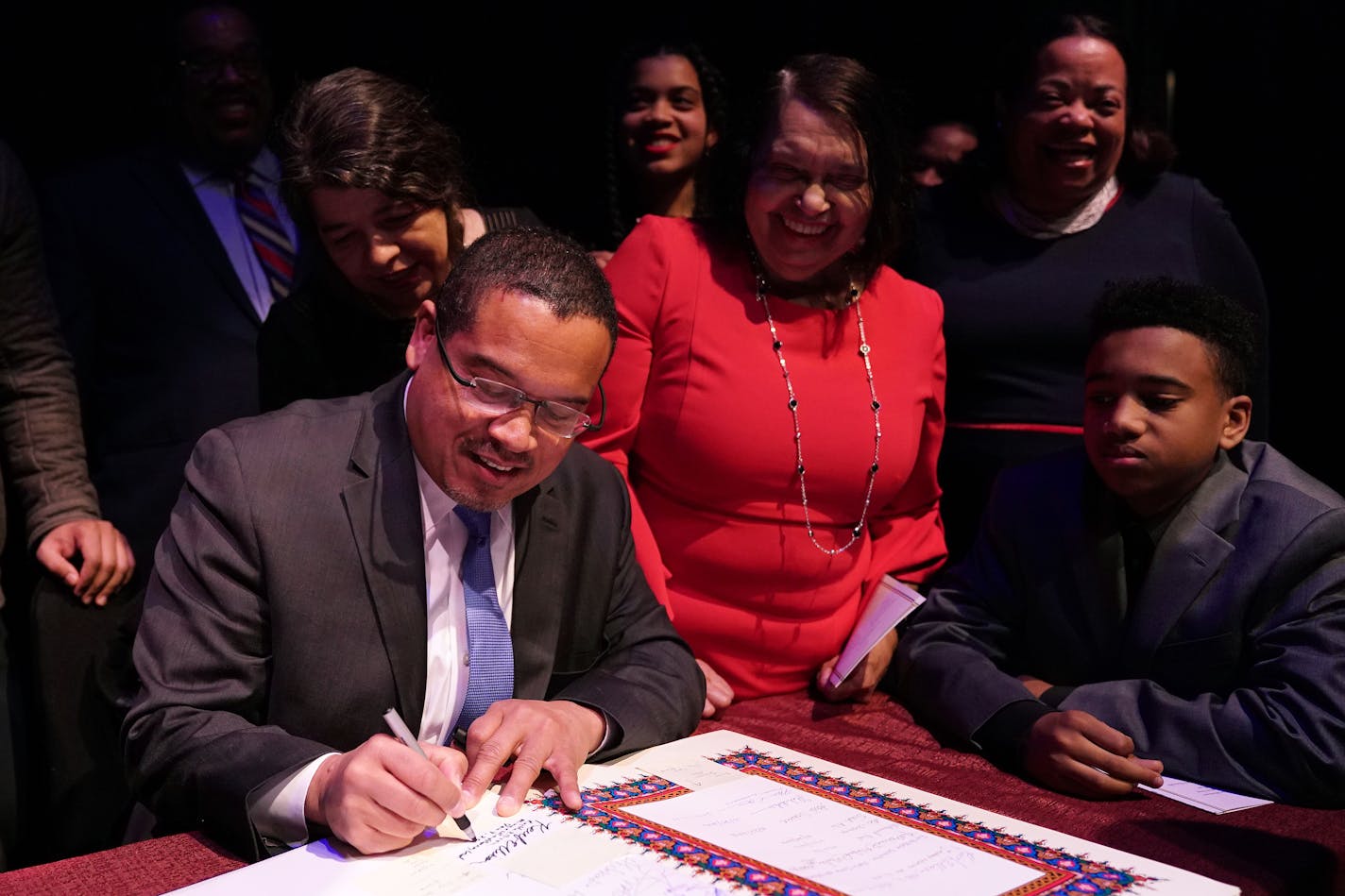 Attorney General Keith Ellison signed the paperwork to make it official after he took the oath of office at the Fitzgerald Theater in St. Paul.