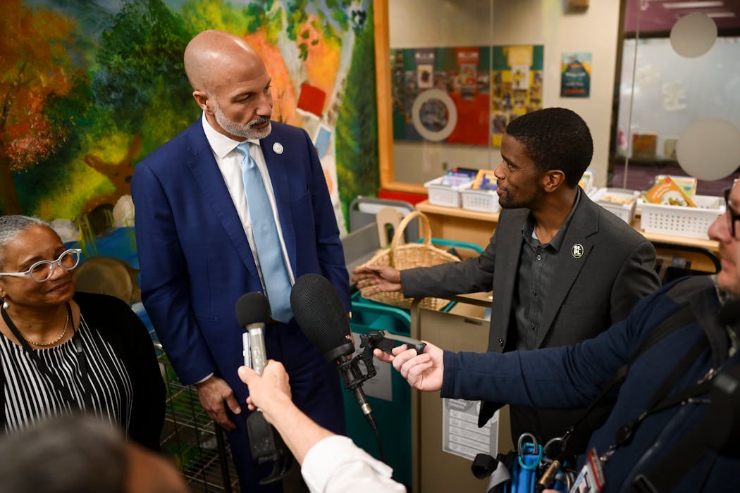 Saint Paul Mayor Melvin Carter congratulated Saint Paul Schools Superintendent Dr. Joe Gothard after a press conference Tuesday at Maxfield Elementary in St. Paul.