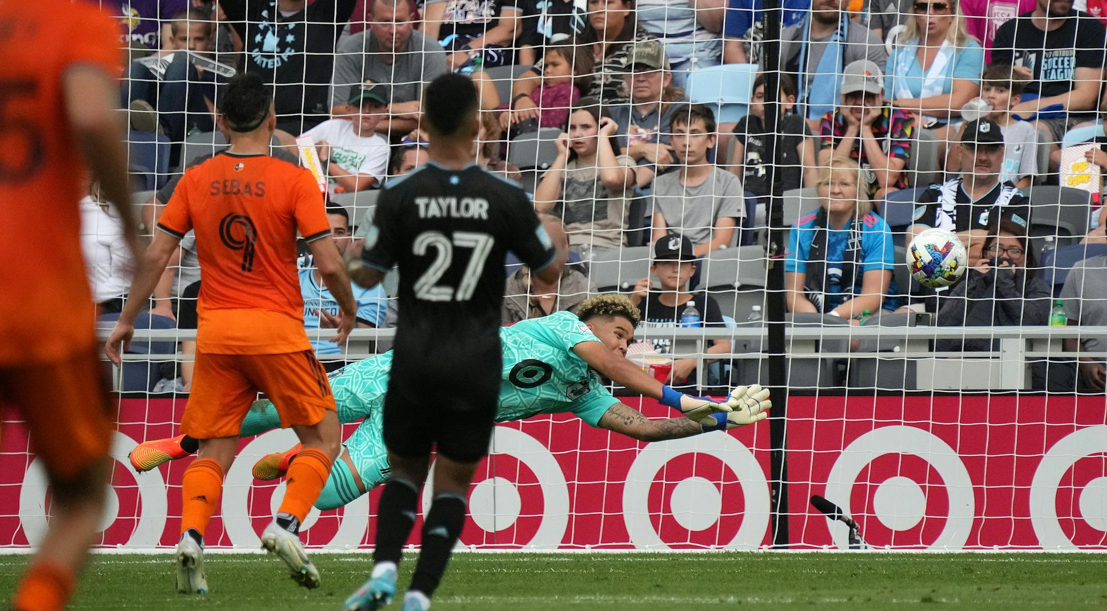 Minnesota United goalkeeper Dayne St. Clair (97) makes a diving save in the second half of an MLS game between Minnesota United and the Houston Dynamo.
