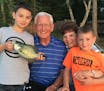 Peyton Hansegard, left, and his brother Jake, of Maple Grove, fishing with their grandparents, Roger and Mary Hansegard.