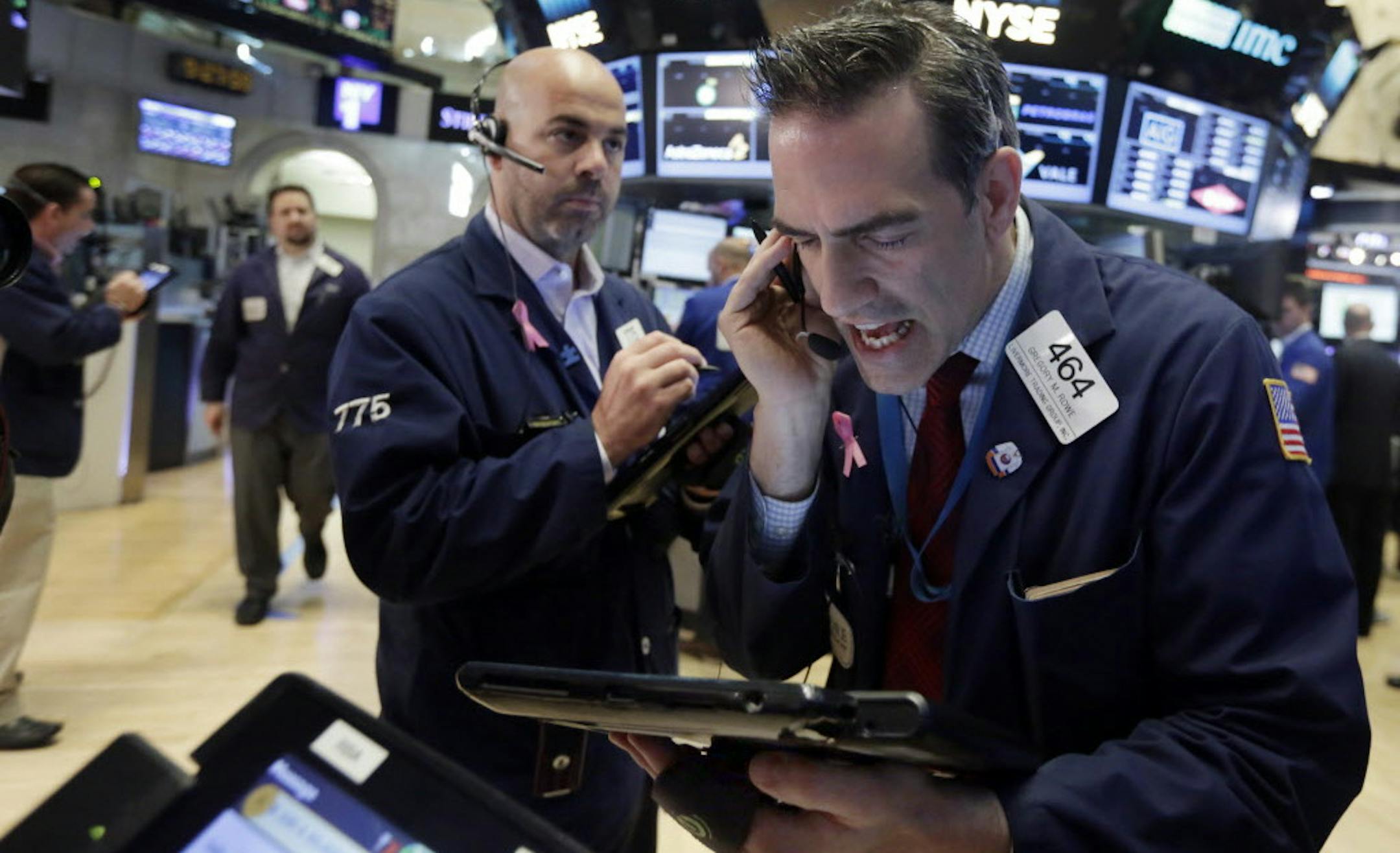 Traders Gregory Rowe, right, and Fred DeMarco work on the floor of the New York Stock Exchange, Friday, June 24, 2016. U.S. stocks are plunging in early trading after Britons voted to leave the European Union. (AP Photo/Richard Drew)