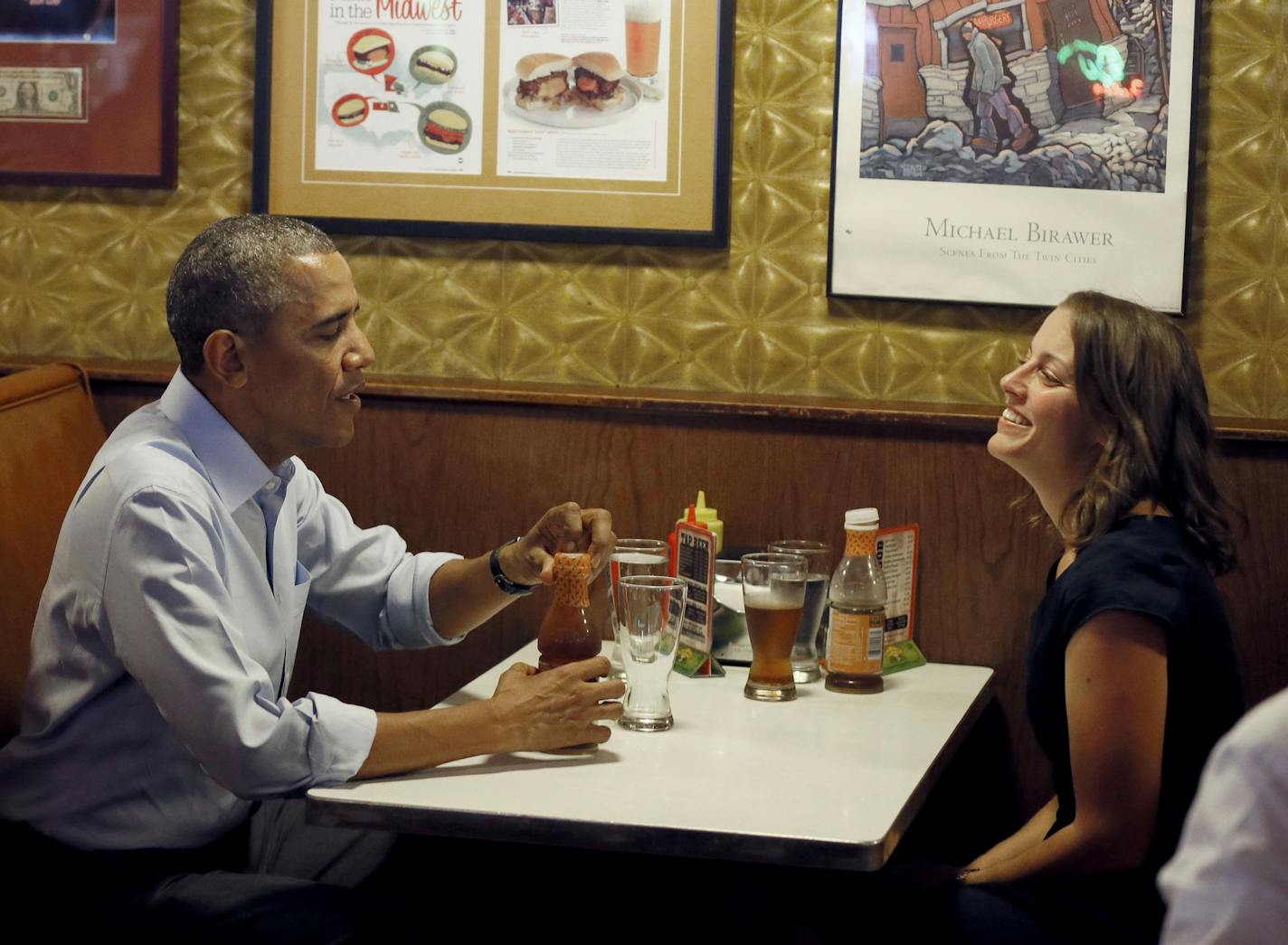 President Barack Obama talked with Rebekah Erler 36 of Minneapolis at Matts Bar before going to a town hall meeting at Minnehaha Park Thursday June 26, 2014 in Minneapolis , MN. ] Jerry Holt Jerry.holt@startribune.com