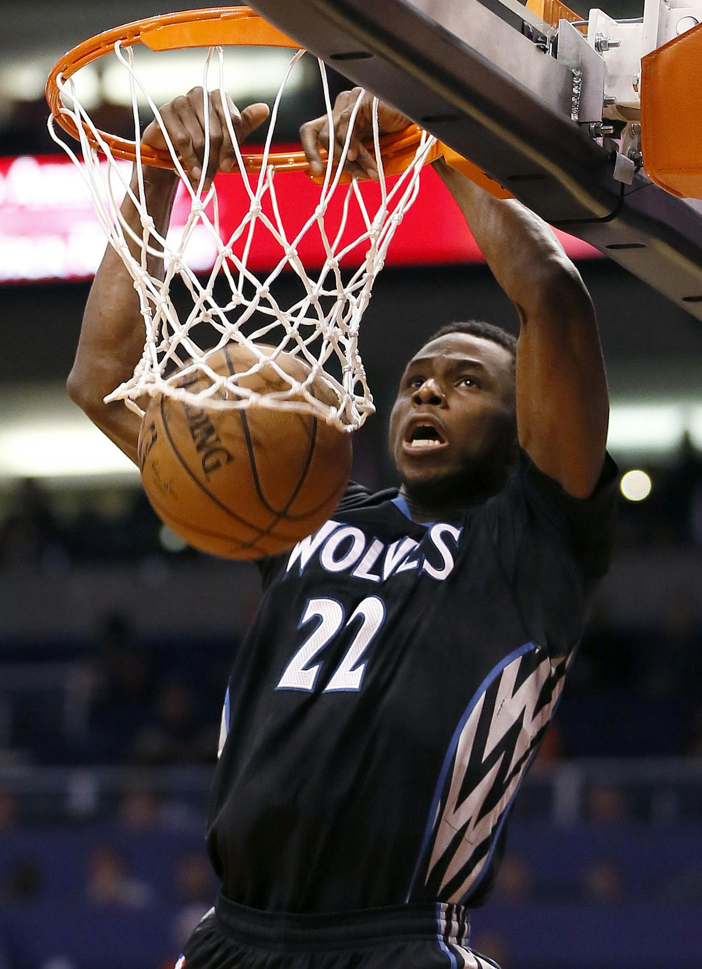 Minnesota Timberwolves' Andrew Wiggins dunks against the Phoenix Suns during the first half of an NBA basketball game, Friday, Jan. 16, 2015, in Phoenix. (AP Photo/Matt York)