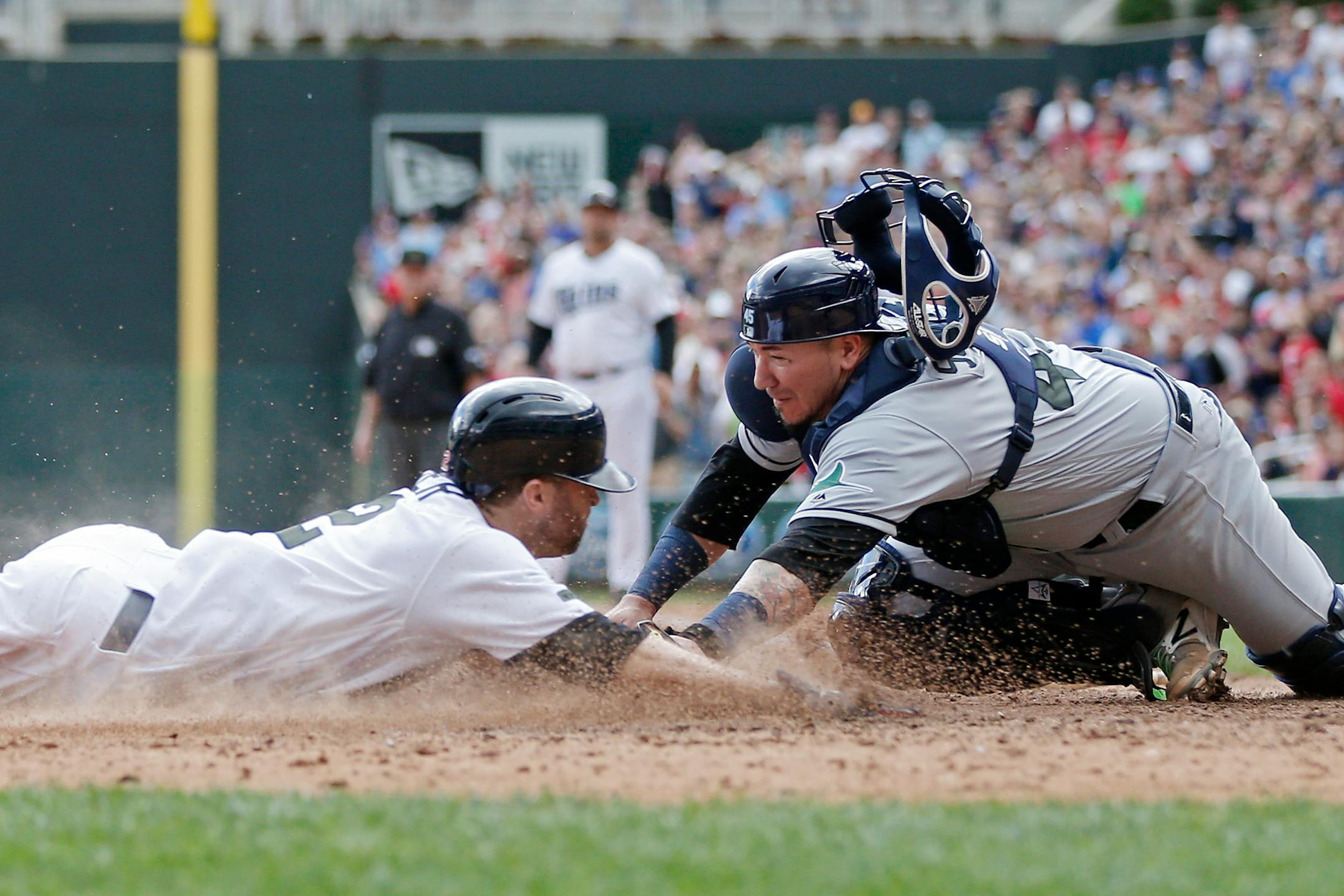 The Twins' Brian Dozier was tagged out by by Rays catcher Jesus Sucre trying to score in the eighth inning Sunday. The Rays eventually won 8-6 in 15 innings.