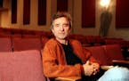 Director Curtis Hanson in the middle of a row in the otherwise vacant James Bridges Theater on the University of California campus in Los Angeles at a
