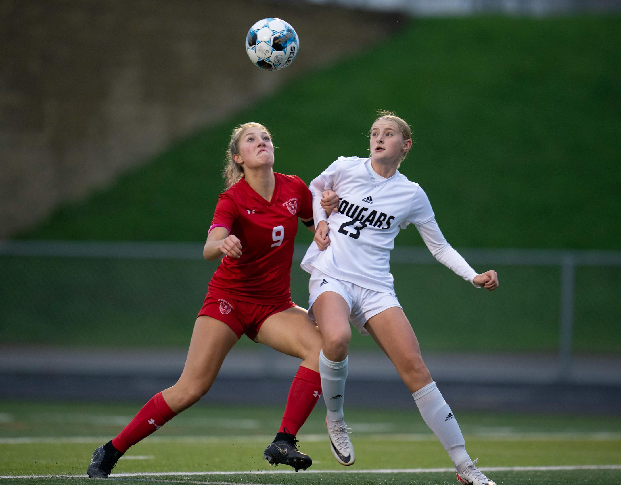 Benilde-St. Margaret's Grace Horejsi positioned herself against Mankato East's Ella Quist for an incoming pass.