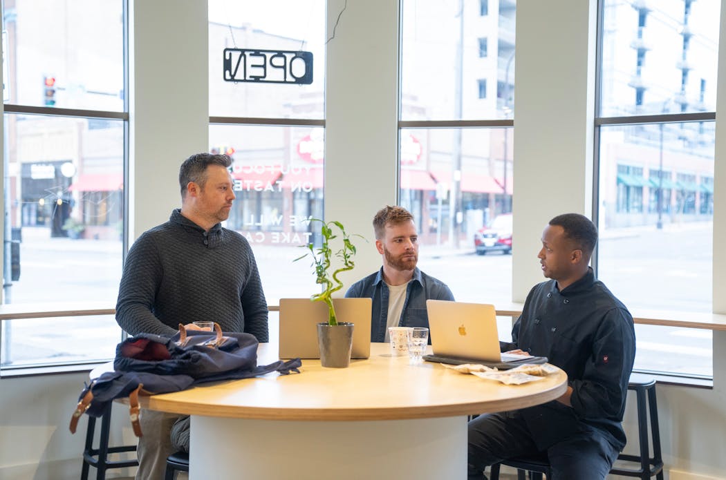From left, Clay Parrish, Charlie Hilligoss and Kamal Mohamed, co-founders and owners of Gallant Tiger, meet to discuss the brand’s organic nut butter and jelly sandwiches.