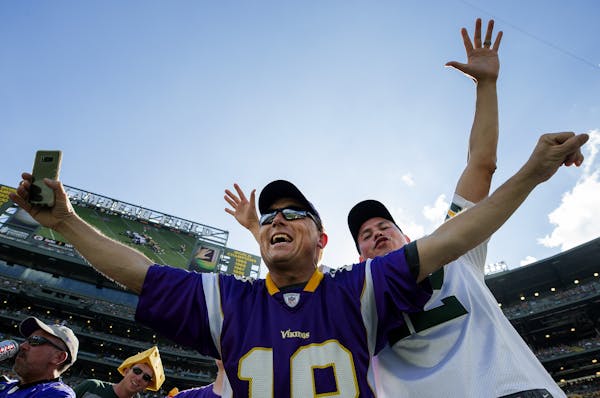 Vikings and Packers fans at Lambeau Field before the tie game in September.