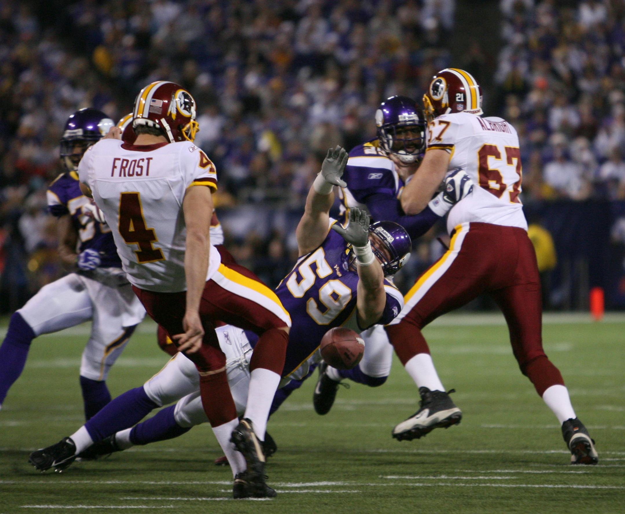Vikings special teams player Heath Farwell (59), aiming to block a punt.