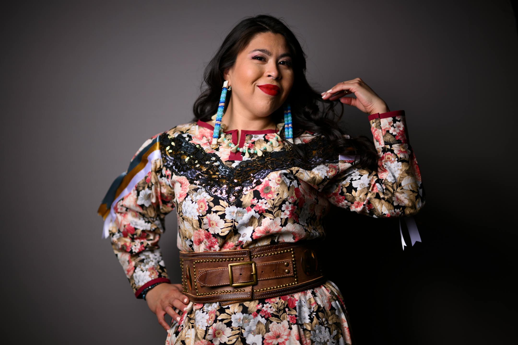 Veronica Kingbird-Bratvold, of the Red Lake Nation, stands for a portrait wearing fashion designed by artist Lavender Hunt during the "Northern Lights: A Native Nations Fashion Night."