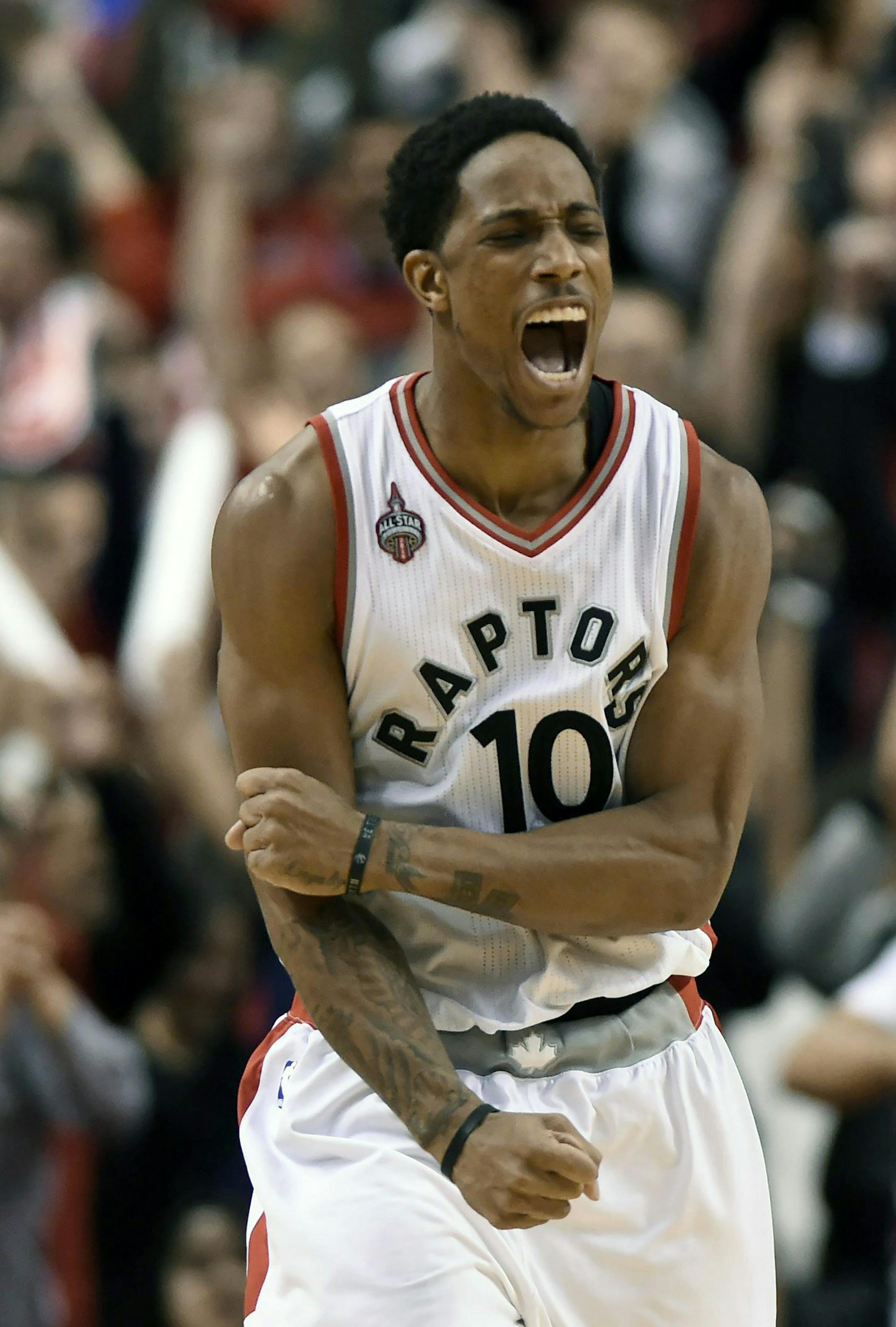FILE - In this April 26, 2016, file photo, Toronto Raptors' DeMar DeRozan (10) celebrates his three-pointer to take the lead against the Indiana Pacers during the second half of Game 5 of an NBA first-round playoff basketball series in Toronto. Toronto's DeMar DeRozan, Atlanta's Al Horford, Memphis point guard Mike Conley and Houston's Dwight Howard are among those who figure to become free agents this summer when the NBA's new television deal will kick in. (Frank Gunn/The Canadian Press via AP,