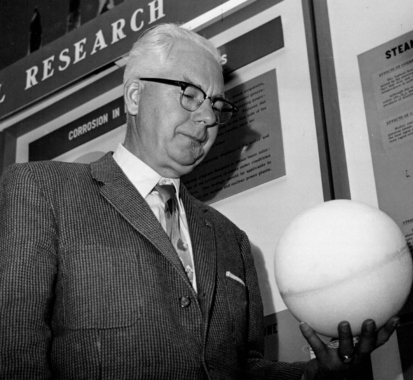 October 19, 1960 Dr. Robert Page, the man who built the first pulse radar system in the United States and director of research at the Naval Research Laboratory. Washington, looks over a Sphere simulating the balloon used in Project Echo. the model is one of the University of Minnesota 10/9 & 20. The Clinic features some of the nation's top researchers. October 18, 1960 UPI Telephoto