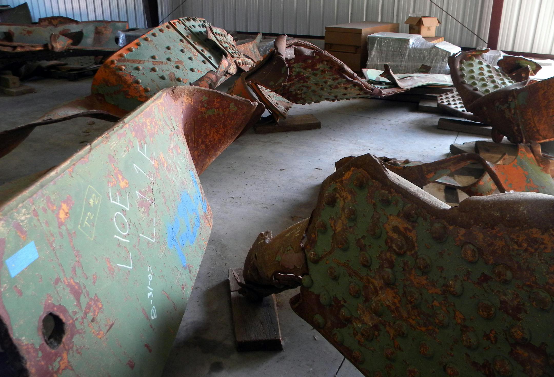 In this July 31, 2012, file photo, rusting beams from the Aug. 1, 2007, Interstate 35W bridge collapse lay on the floor of a Minnesota transportation department garage in Oakdale, Minn.