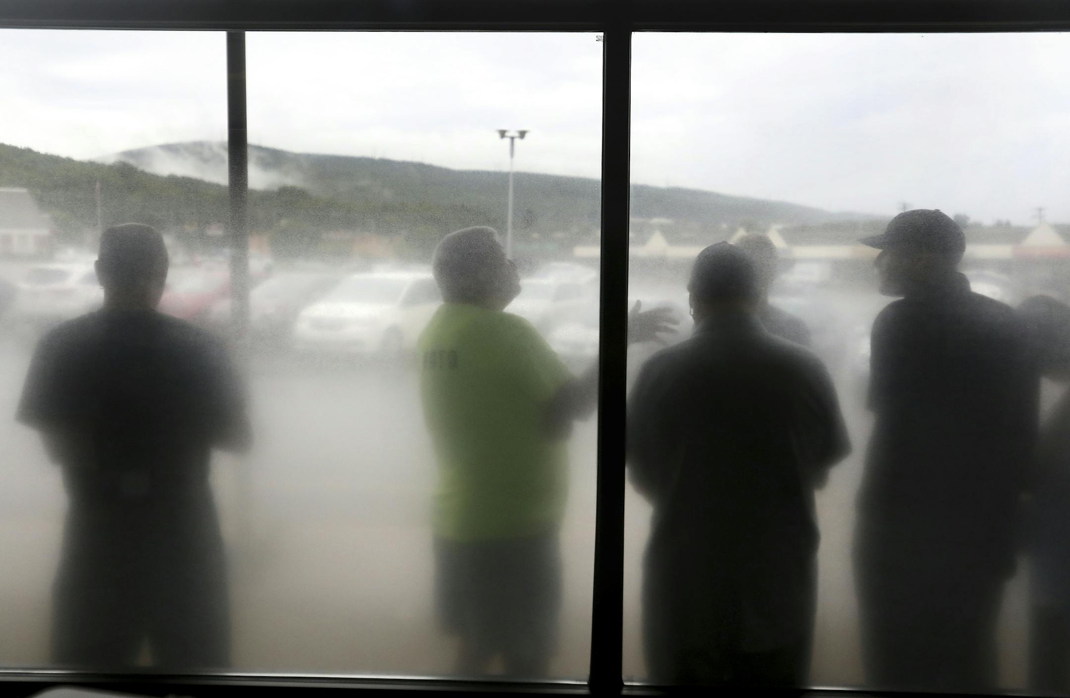 Patients prescribed medical marijuana line up to purchase their medicine from Columbia Care Pa., Wednesday, Aug. 1, 2018, in Scranton, Pa. Wednesday is the first day patients can purchase the dry leaf form of medical marijuana in Pennsylvania. (Jake Danna Stevens/The Times-Tribune via AP)