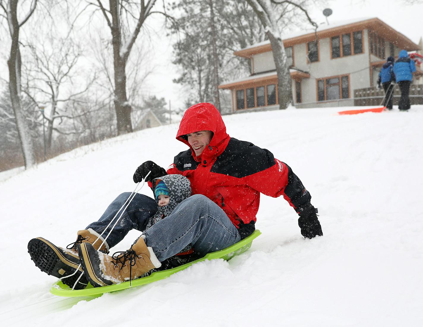 Paul Frank took his son Jasper, 2, sledding for the first time Tuesday morning at Audubon Park. ] ANTHONY SOUFFLE &#x2022; anthony.souffle@startribune.com A heavy snow blanketed the area Tuesday, Jan. 10, 2017 in Minneapolis.