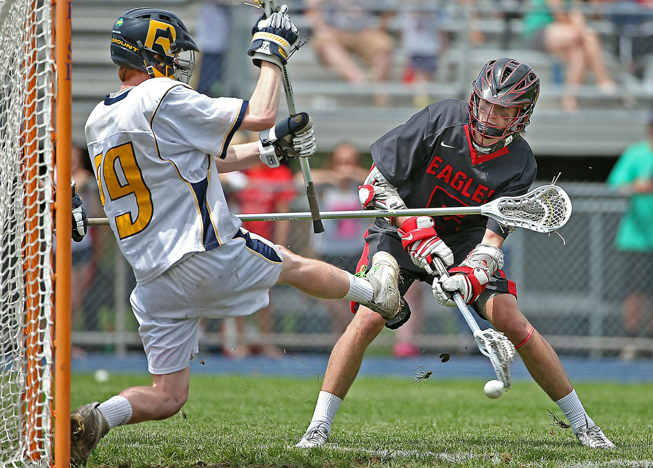 Eden Prairie's Sean Patterson made a goal passed Rosemount's Shaun Skrbecin the third period during the boy's lacrosse Championship game at Rosemount High School, Tuesday, June 17, 2014. ] (ELIZABETH FLORES/STAR TRIBUNE) ELIZABETH FLORES • eflores@startribune.com ORG XMIT: MIN1406171456210081