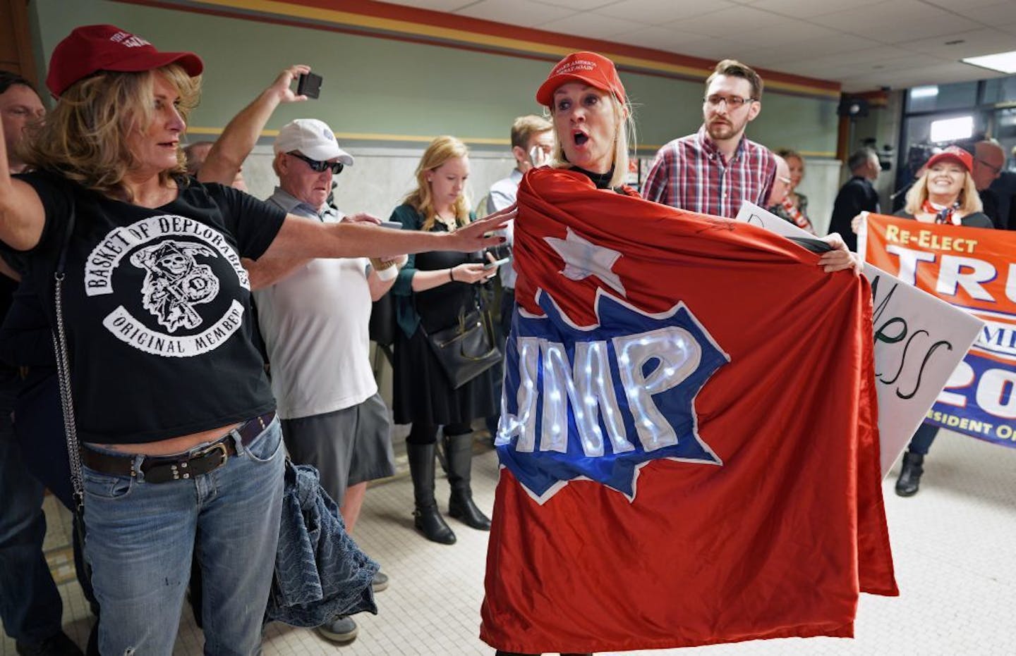 A group of about 30 Trump supporters gathered for a rally at noon Wednesday outside Mayor Jacob Frey's office in City Hall, to show "how displeased they are with his behavior over the Trump visit. Here, Sheri Auclair of Wayzata (left) and Mary Susan Timion, cloaked in a light up Trump cape, spoke out against Mayor Frey's recent efforts to bill the Trump campaign for security costs for his Thursday rally.