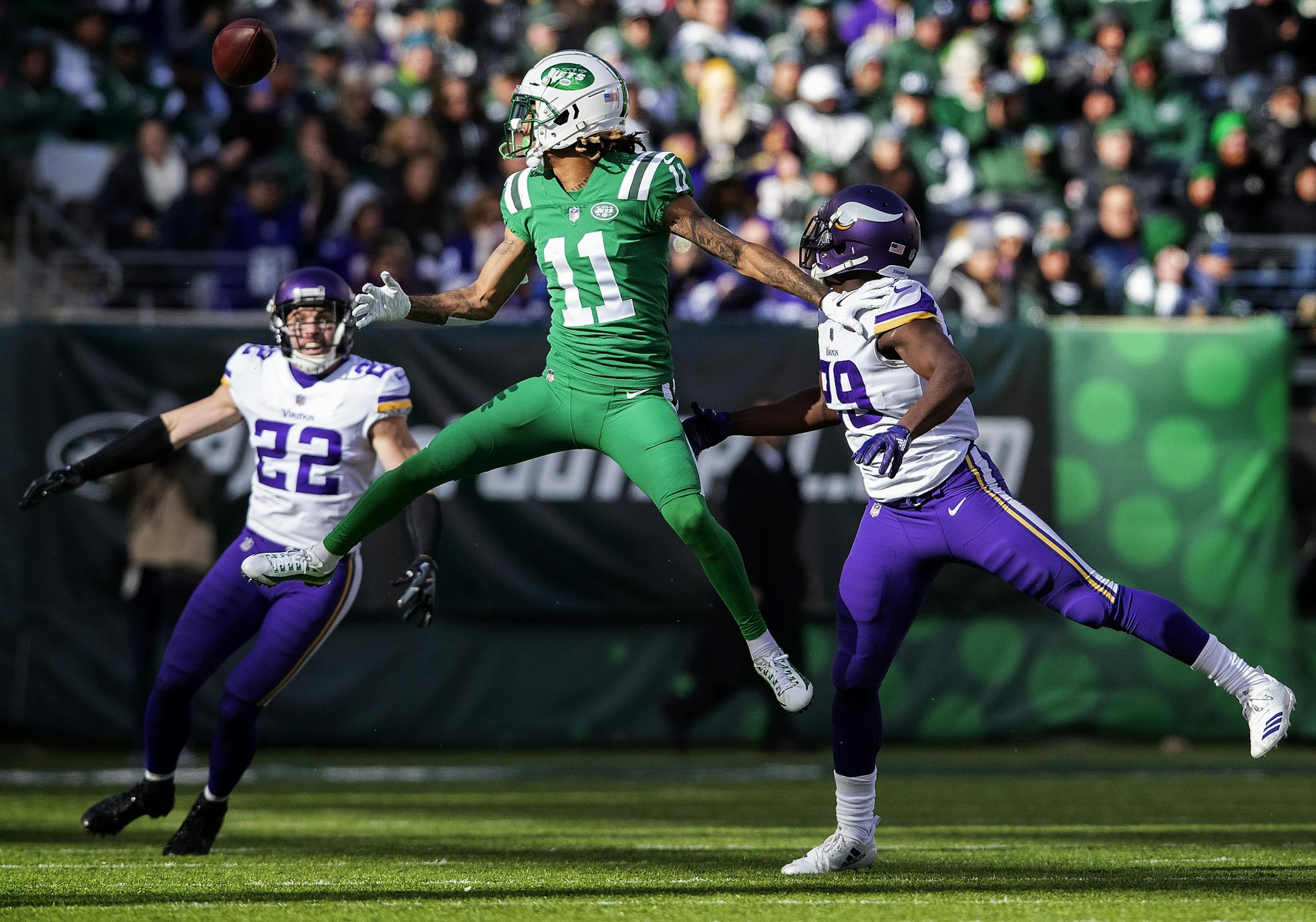 Xavier Rhodes (29) broke up a pass intended for Robby Anderson (11) in the third quarter. Harrison Smith (22) intercepted the ball on the play.