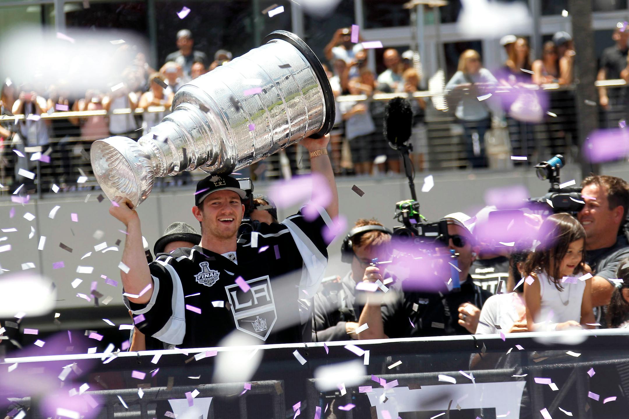 Los Angeles Kings goalie Jonathan Quick displayed the Stanley Cup while riding in a parade downtown Los Angeles on Monday. The parade and rally were held to celebrate the Kings' second Stanley Cup championship in three seasons.